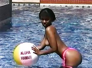 Beautiful Asian girl goes totally naked by the pool and reveals tits