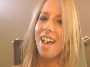 Flirty blonde with a shaved and pierced pussy masturbating