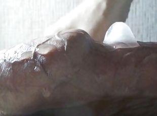 Experiment with ice cubes on a hot huge cock of a young guy