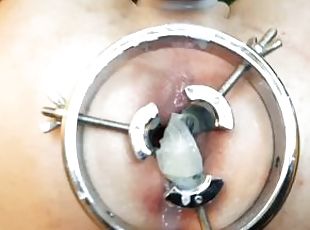 Dominatrix Nika inserted an anal dilator into the slave's ass and poured sperm from his condom into
