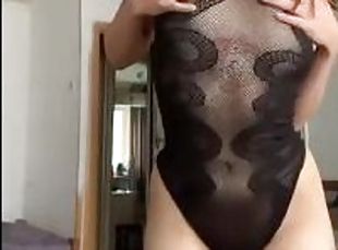 young tattooed girl in a transparent swimsuit teases you after work