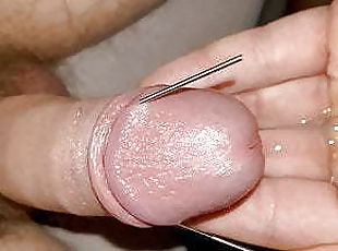 Amateur thin needle in cock and cum closeup
