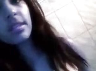 Nasty brunette girl flashes her shaved pussy for the webcam