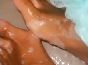 ebony babe soaping up dirty soles in the shower