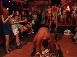 Male stripper teases the ladies at the party