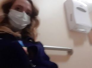 Milf in Northface Plays With Pussy In Public Bathroom