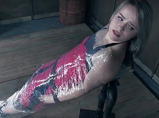 Tattooed blonde teen slave Bambi Belle wrapped up in plastic