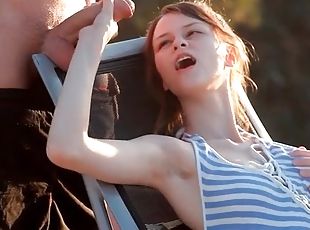 Skinny teen blows her man as the sun sets