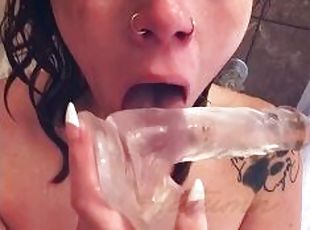 Gagging on clear dildo in shower