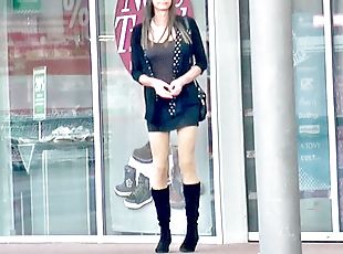 Crossdresser TGirl in short skirt and boots outside