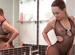 Small tits chick models her sexy fishnet dress