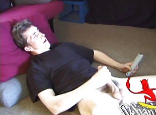 On the floor of his room, Derek rubs his crotch hard. Soon he pulls out his cock and strokes it until he finally cums on her stomach.