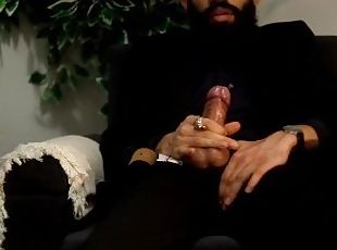Daddy in a black suit smoking, stroking his big cock and moaning