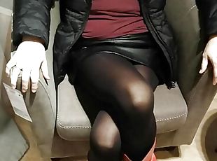 Fully dressed crossed legs orgasm in a store