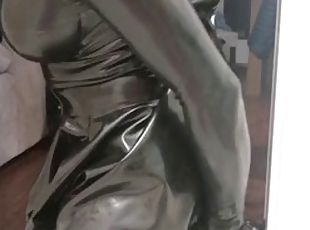 Rubber latex sissy in gas mask plays with a dildo