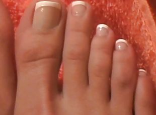 A chick boasts of her beautiful pedicured feet and manicured hands