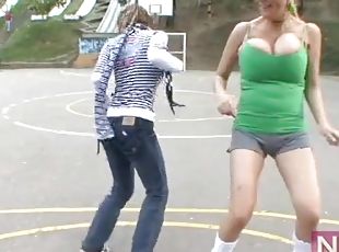 Big breasts girls play soccer outdoors