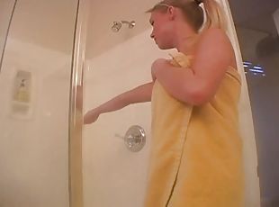 Watch this video to see this busty blonde masturbating in the shower