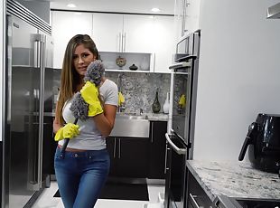 Busty woman stops cleaning around the house to pose nude
