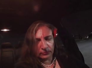 Horny mature crossdresser plays with a stick in public at night