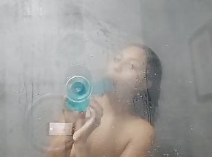 vShowering in the hotel bathroom and masturbation with the dildo
