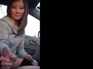 Lovely horny Asian girl gave her partner handjob in car