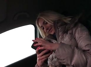 Chick in tight turtleneck is sexy in the car