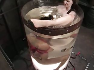 Two hot chicks use a strap-on in great water bondage video