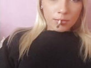Sexy blonde girl smoke a cigarette